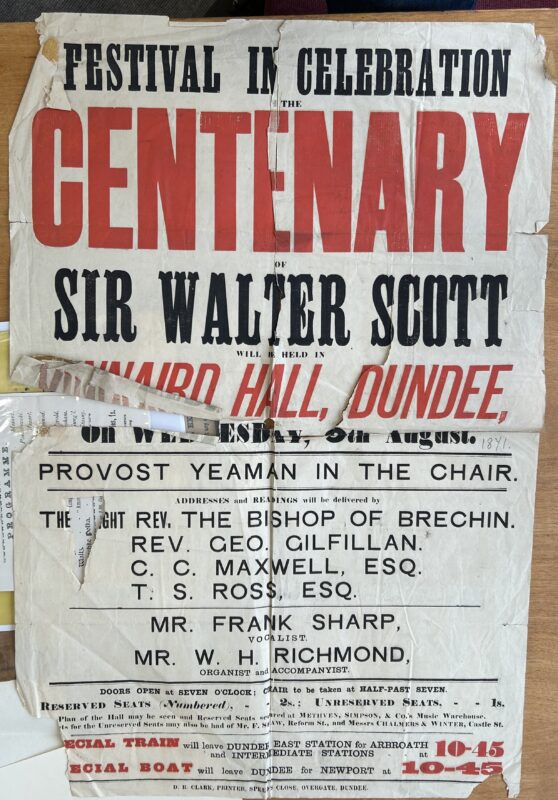 Large, worn nineteenth-century poster announcing a “Festival in Celebration of the Centenary of Sir Walter Scott” at Kinnaird Hall, Dundee, on Wednesday 8 August. Printed in bold black and red lettering, the poster lists Provost Yeaman as chair, speakers including the Bishop of Brechin and Rev. George Gilfillan, vocalist Frank Sharp, and accompanist W. H. Richmond. Admission prices, train and boat transport arrangements, folds, tears, and repairs are visible across the paper.