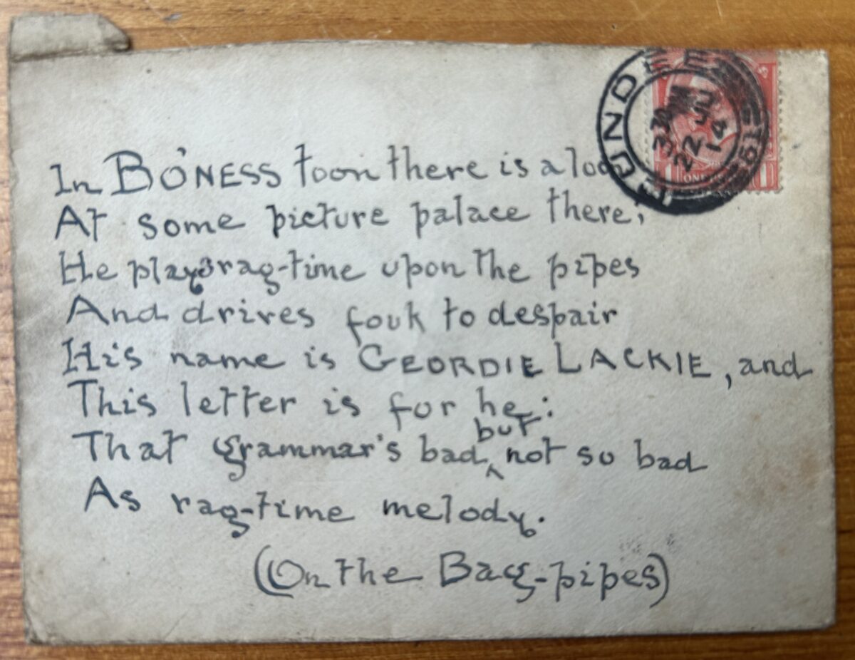 Handwritten postcard featuring a humorous rhyming message about music hall performer Geordie Lackie. Addressed to a picture palace in Bo’ness, the card jokes about Lackie’s ragtime-style bagpipe playing. A red one-penny King George V stamp and circular postal cancellation are visible in the upper right corner.