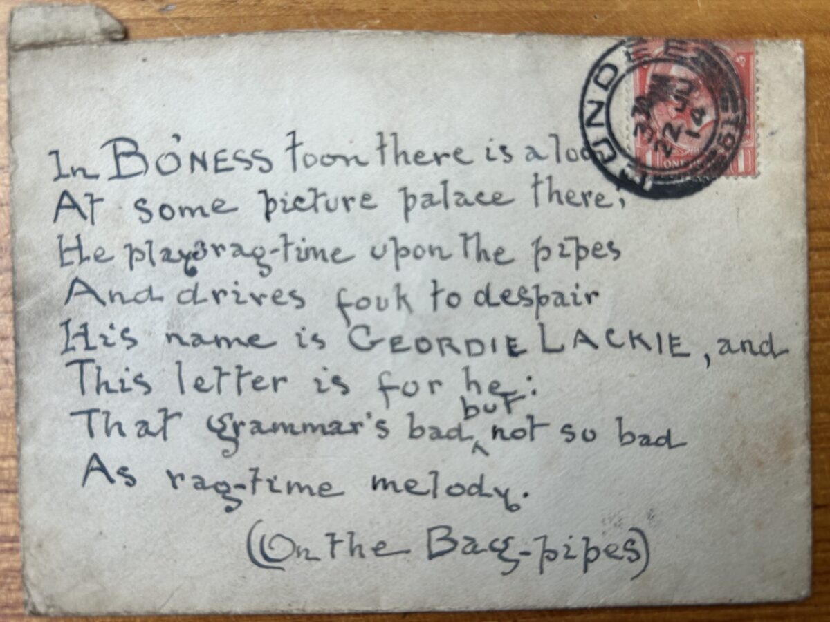 Handwritten postcard featuring a humorous rhyming message about music hall performer Geordie Lackie. Addressed to a picture palace in Bo’ness, the card jokes about Lackie’s ragtime-style bagpipe playing. A red one-penny King George V stamp and circular postal cancellation are visible in the upper right corner.