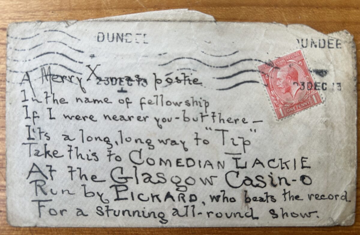 Black-and-white handwritten postcard bearing a Scots verse addressed to Geordie Lackie, the “Piper O’ Dundee”. The card praises Glasgow’s Gaiety Hall and includes a red King Edward VII postage stamp with postal cancellation marks.