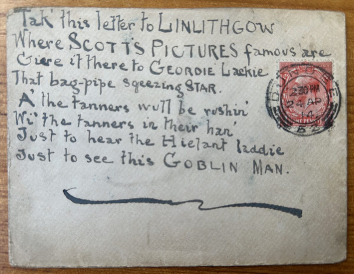 Envelope addressed to performer Geordie Lackie in Linlithgow. The front is covered with a handwritten verse praising Lackie as a “bag-pipe squeezing star” and a “Hielant laddie”. A red one-penny King George V stamp and circular postmark appear on the right-hand side. The envelope is worn and creased from handling and postal use.