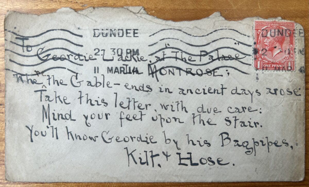 Handwritten postcard bearing a humorous Scots poem addressed to Geordie Lackie, the “Piper o’ Dundee.” The card is postmarked Dundee and features a red King George V one-penny stamp, with the verse written across the entire reverse side in black ink.